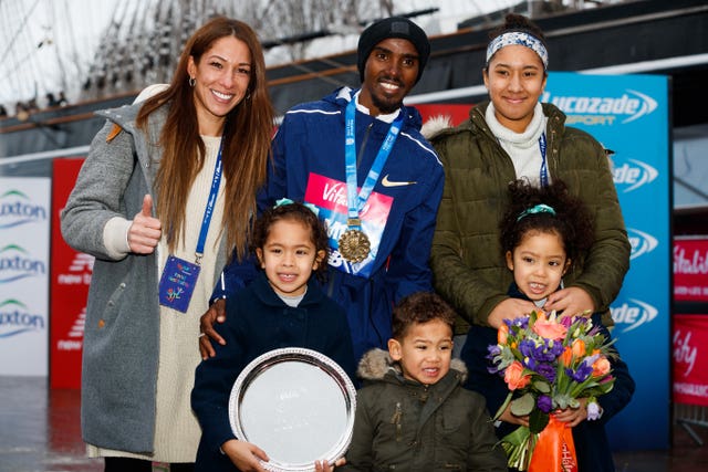 Farah celebrated with his wife Tania (left) daughter Rihanna (right) twins Aisha and Aman and son Hussein after winning the Vitality Big Half in London on Sunday (John Walton/PA)