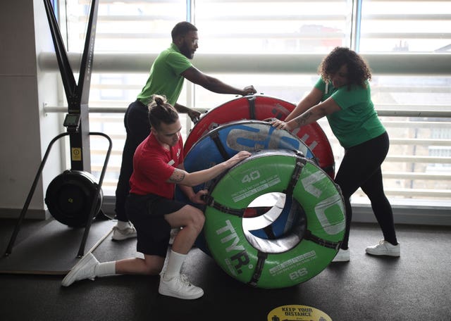 Staff at Clapham Leisure Centre in south London ready the gym facilities for reopening