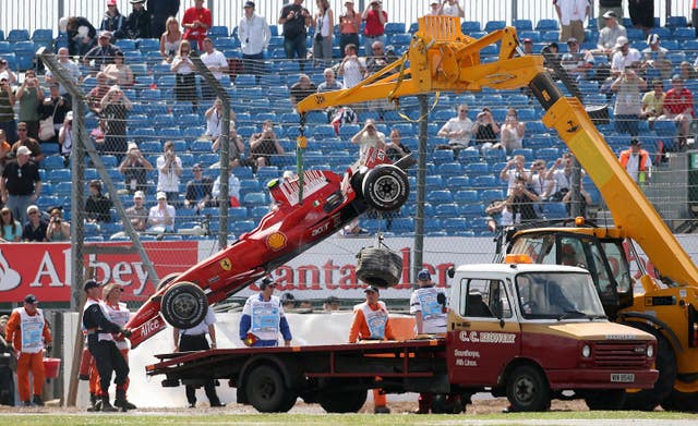 Ferrari’s Felipe Massa’s car is put on a truck to take it back to the garage at Silverstone (PA)