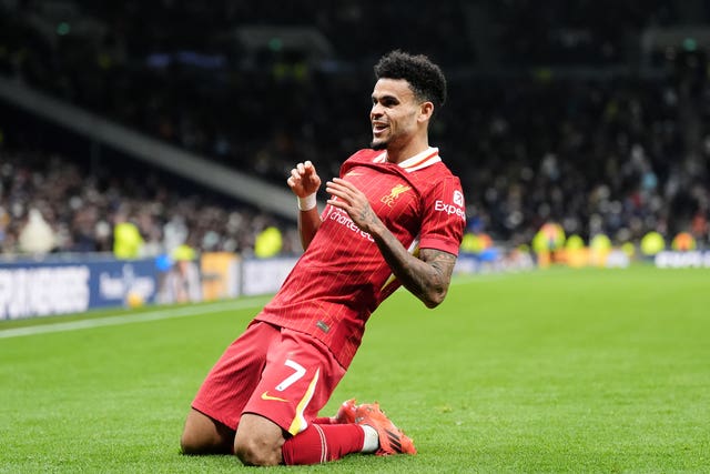 Liverpool’s Luis Diaz slides on his knees