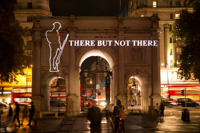 A First World War Tommy projected on to Marble Arch in London
