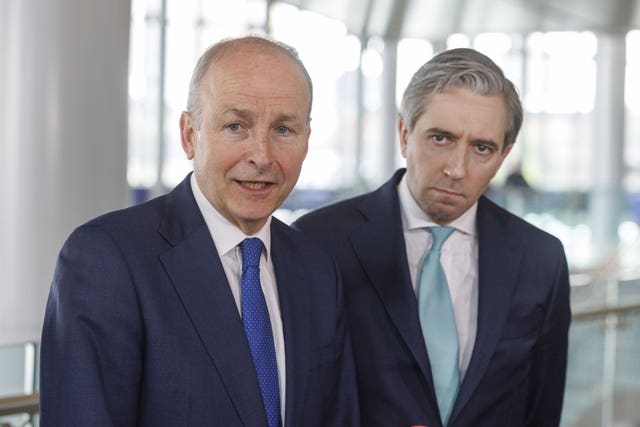 Taoiseach Micheal Martin and Irish Minister for Finance and Tanaiste Simon Harris during a press conference giving reaction after an event at Grand Central Station to mark the signing of a £550 million (700 million euro) contract for a new fleet of Enterprise trains, during his visit to Belfast