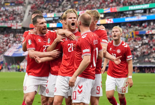 Denmark’s Morten Hjulmand celebrates his equaliser with his team-mates