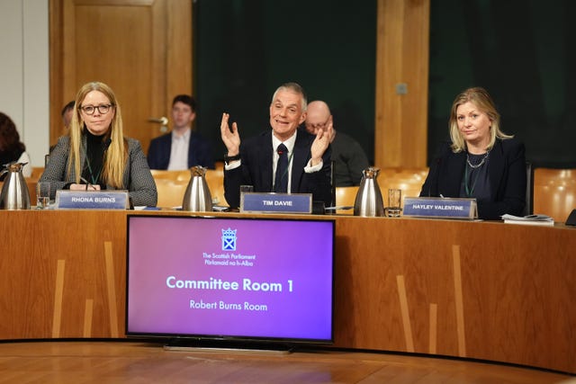 Rhona Burns, Tim Davie and Hayley Valentine seating during Holyrood committee hearing