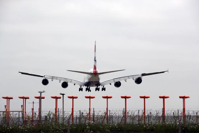 A plane flies over Heathrow