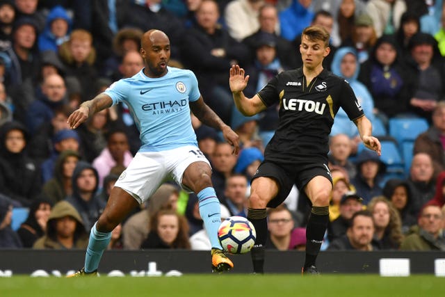 Fabian Delph, left, has impressed in various positions for Manchester City