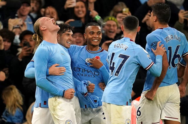 Erling Haaland, left, celebrates his last-minute winner