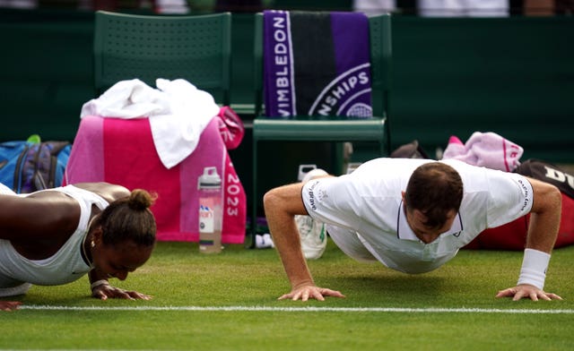 Jamie Murray, right, and Taylor Townsend do press-ups as a forfeit for poor serving from the British player following their mixed doubles victory