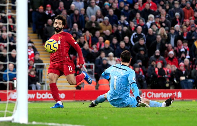 Liverpool’s Mohamed Salah (left) scores a brace in the 4-0 win over Southampton