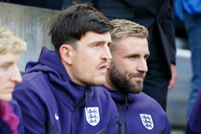 Harry Maguire, left, and Luke Shaw on the England bench watching Monday's win over Bosnia and Herzegovina
