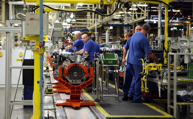 Engineers work at the Ford engine plant near Bridgend, South Wales