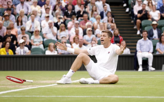 Neal Skupski celebrates after the match-clinching point