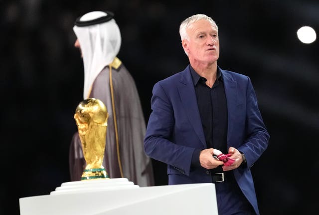 France manager Didier Deschamps collects his runners-up medal