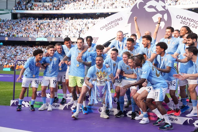 Manchester City players celebrate after winning the 2023-24 Premier League title last month - their fourth season in a row as top-flight champions