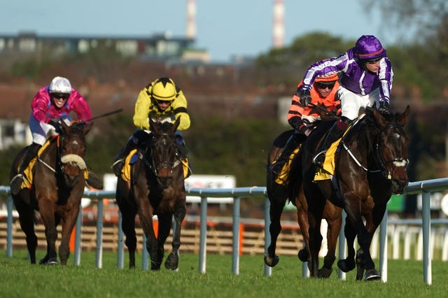 High Definition ridden by jockey J J Slevin (right) on their way to winning the All About Sunday Maiden Hurdle during day one of the Leopardstown Christmas Festival at Leopardstown Racecourse