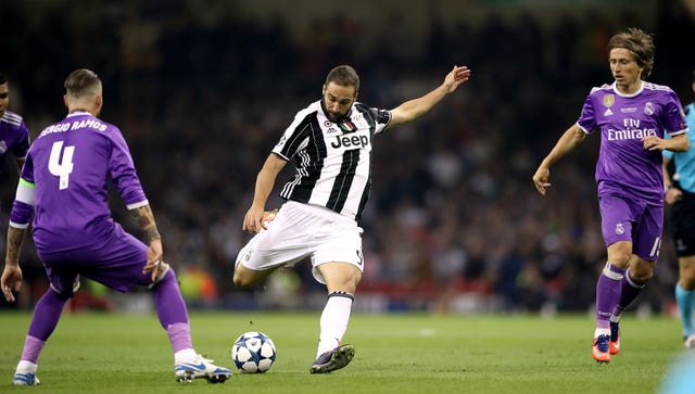 Juventus' Gonzalo Higuain has a shot on goal