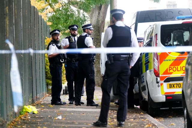 Metropolitan Police officers at the scene of the stabbing
