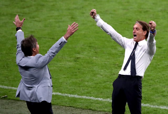 Italy manager Roberto Mancini (right) celebrates victory in their Euro 2020 game at Wembley