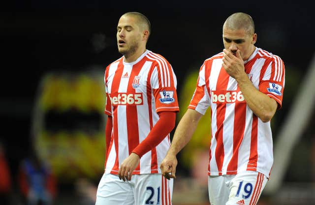 Jonathan Walters, right. leaves the pitch after scoring two own goals and missing a penalty against Chelsea