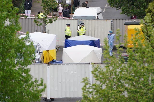 Police forensic tents outside a house in Bermondsey, south-east London, after three women and a man were stabbed to death in the early hours of Monday. 