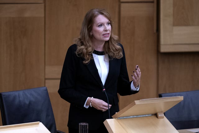 Ash Regan standing while speaking in Holyrood