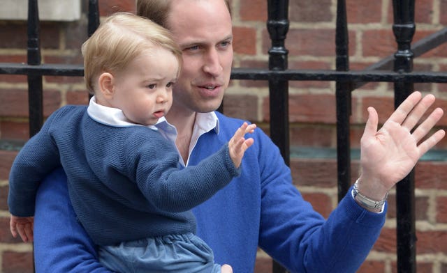 A young Prince George with his father William as they visit Kate and Princess Charlotte in the Lindo Wing in 2015 (Anthony Devlin/PA)