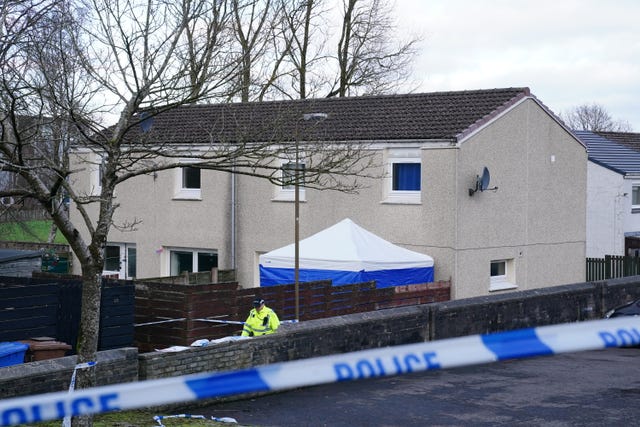 A forensic tent outside the house