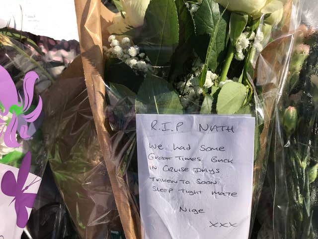 A floral tribute at the scene (Pat Hurst/PA)