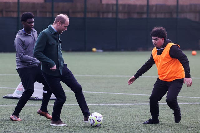 William playing football