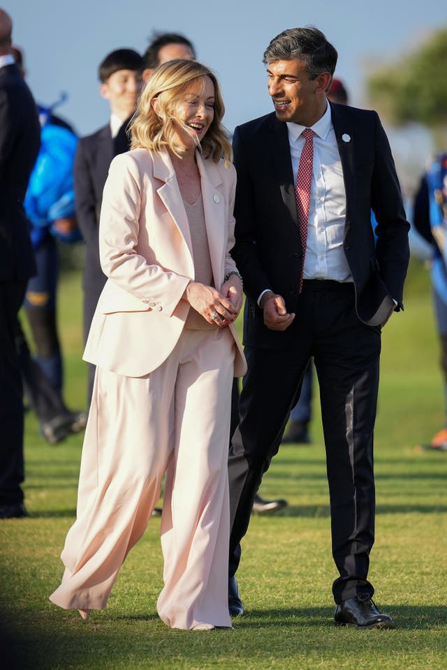 Prime Minister Rishi Sunak walks with Italian Prime Minister Giorgia Meloni at the G7 summit in Italy