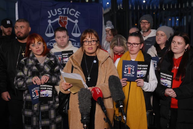 Toni Ogle-Johnson (centre), daughter of Ian Ogle, speaking outside Laganside Courts, Belfast