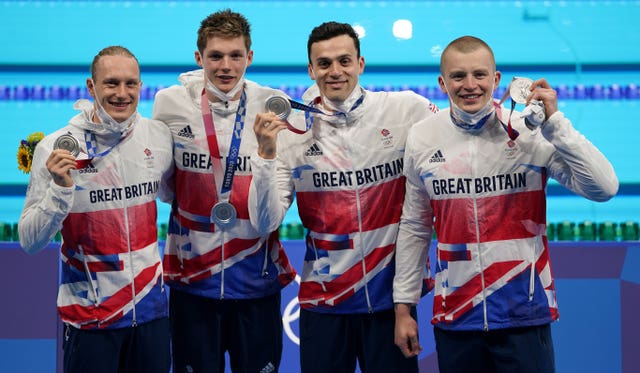 Great Britain’s (left-right) Luke Greenbank, Duncan Scott, James Guy and Adam Peaty after winning the silver medal in the men’s 4x100m medley relay
