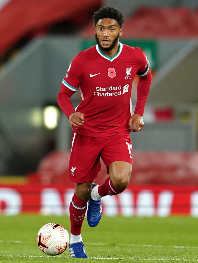 Liverpool’s Joe Gomez runs with the ball at his feet