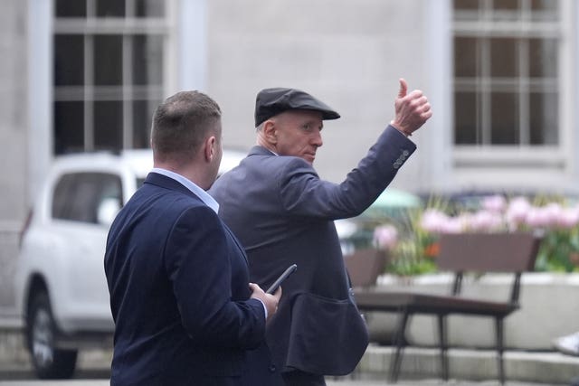 Independent TD Michael Healy-Rae gives a thumbs-up to the crowds gathered outside Leinster House, Dublin, after resigning in the Dail