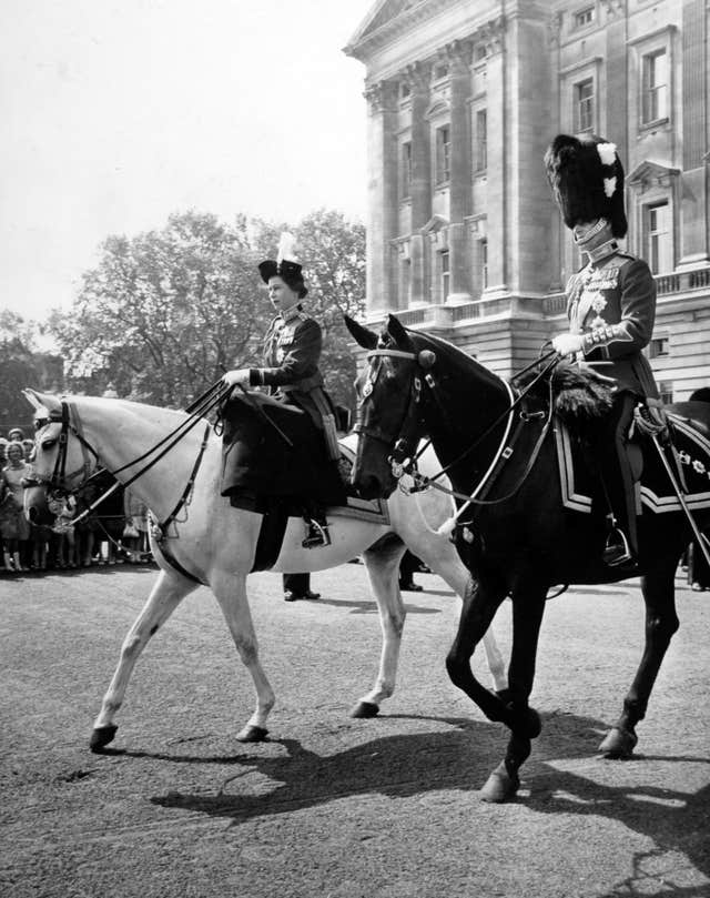 Philip, seen with the Queen, attended Trooping the Colour on horseback until he was 82 (Archive/PA)