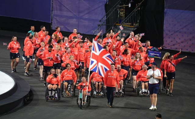 Flagbearers Lucy Shuker and Terry Bywater led ParalympicsGB into Place de la Concorde 