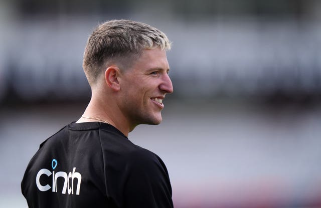 England's Brydon Carse smiles as he looks to the right