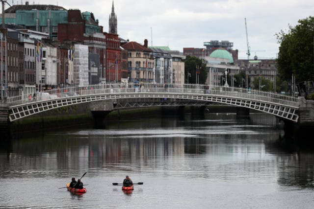 People kayak on the river Liffey in Dublin (Brian Lawless/PA)