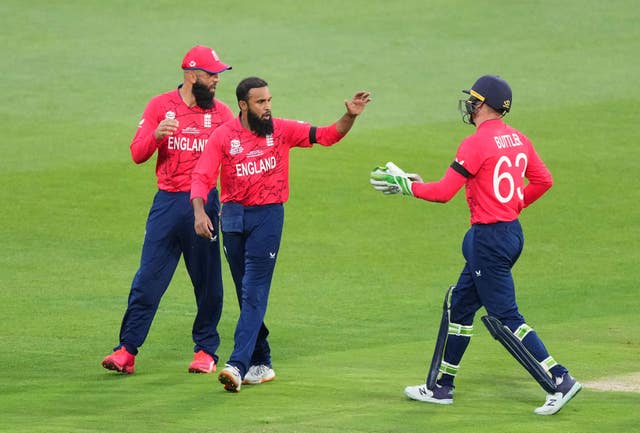 Adil Rashid, centre, is a double World Cup winner (PA)