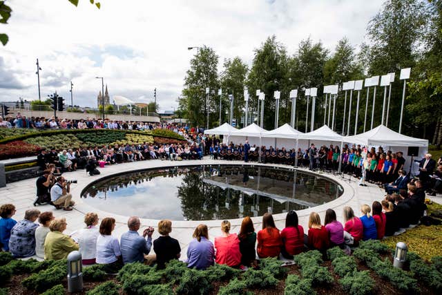 Family and relatives gather at the inter-denominational service at the Memorial Gardens in Omagh