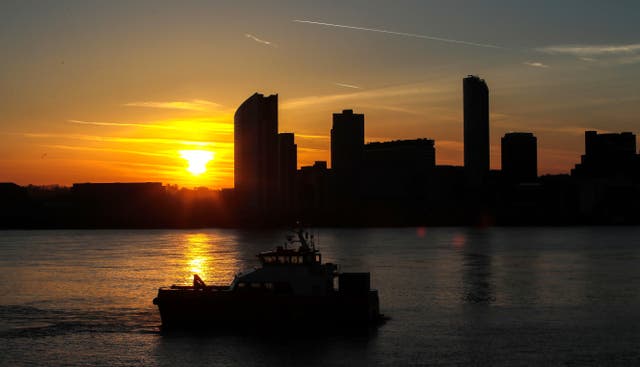 The sun rising behind the Liverpool skyline (Peter Byrne/PA)