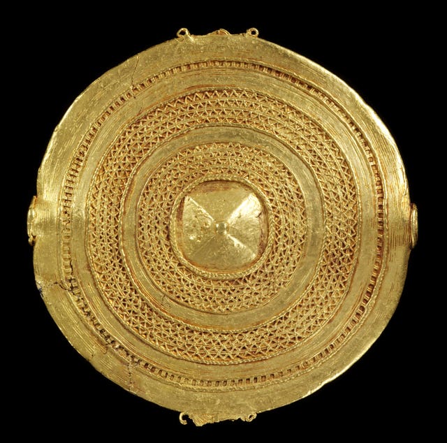A cast gold badge 