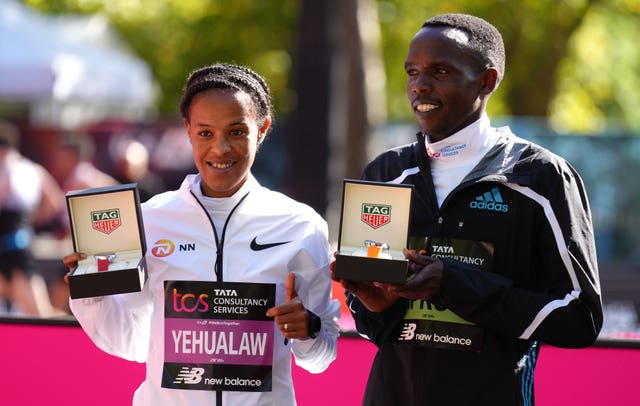 Yalemzerf Yehualaw, left, and Amos Kipruto won the women's and men's races at the London Marathon (John Walton/PA)