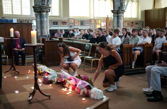 People at a vigil at St Peter’s church in Nottingham