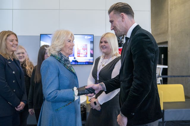 The Queen being introduced to Aberdeen FC defender Angus McDonald