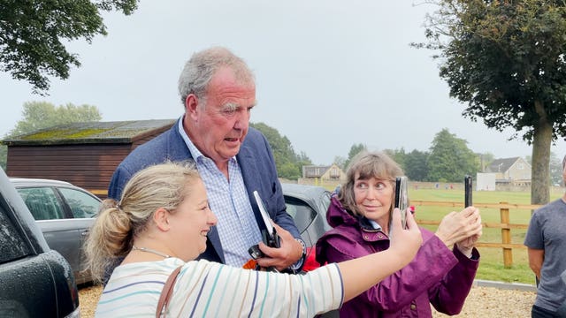 Jeremy Clarkson with fans at the Memorial Hall in Chadlington, where he held a meeting with local residents over concerns about his Oxfordshire farm shop