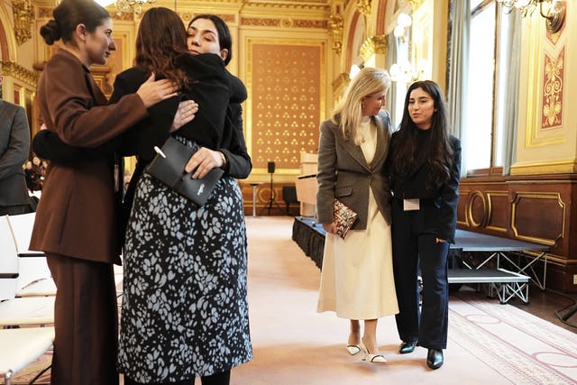 The Duchess of Edinburgh speaking to Yazidi survivor Awaz Abdi (right) during her visit to view The Women Who Beat ISIS exhibition