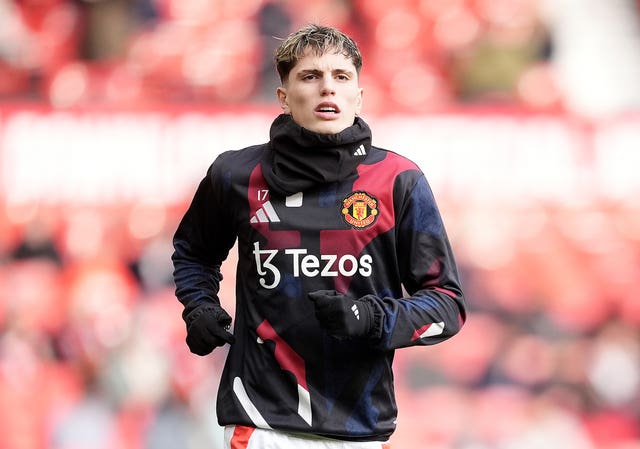 Manchester United’s Alejandro Garnacho warms up ahead of the Premier League match at Old Trafford,