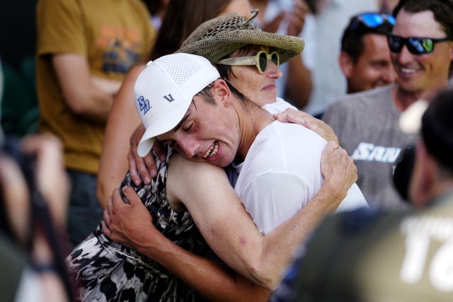 Oliver Tarvet hugs a spectator
