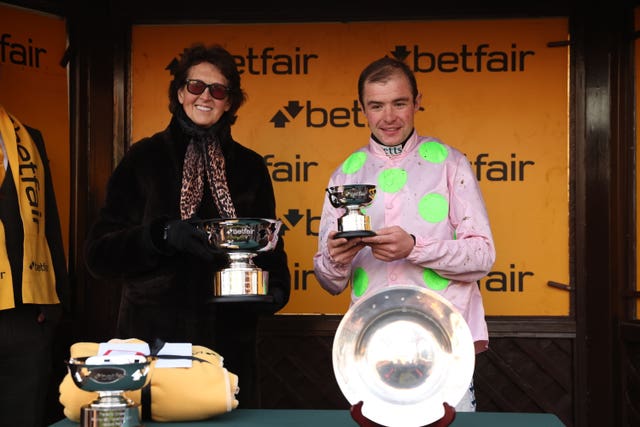 Venetia Williams and Charlie Deutsch with their trophies 